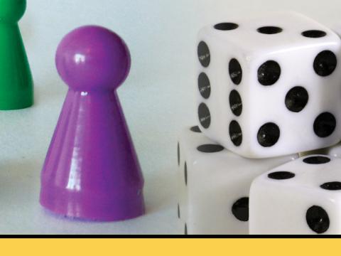 Image of dice and game piece