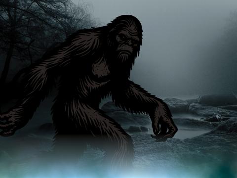 bigfoot silhouette with foggy gray background